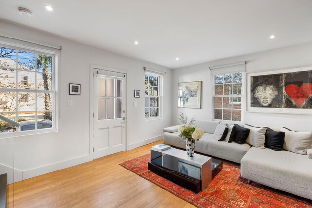 301 Broad St Unit 1, Charleston, SC 29401 - living area with plenty of natural light, wood finished floors, recessed lighting, and baseboards