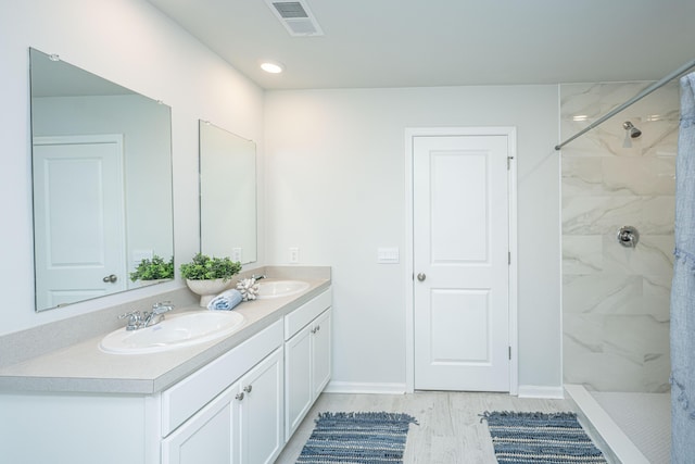 101 Orchid Bloom Cir, Moncks Corner, SC 29461 - full bath featuring double vanity, a marble finish shower, and baseboards