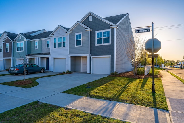 101 Orchid Bloom Cir, Moncks Corner, SC 29461 - townhome / multi-family property featuring concrete driveway, an attached garage, and a front yard