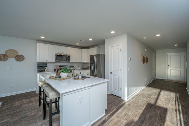 101 Orchid Bloom Cir, Moncks Corner, SC 29461 - kitchen featuring appliances with stainless steel finishes, a sink, dark wood-style flooring, light countertops, and recessed lighting