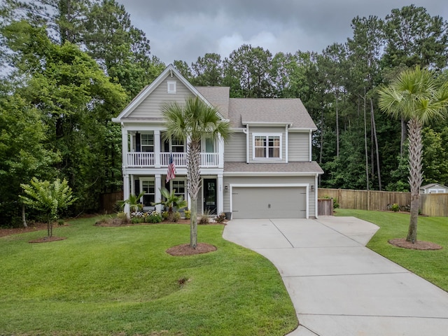 125 Beam St, Huger, SC 29450 - view of front of house featuring concrete driveway, a garage, roof with shingles, a balcony, and covered porch