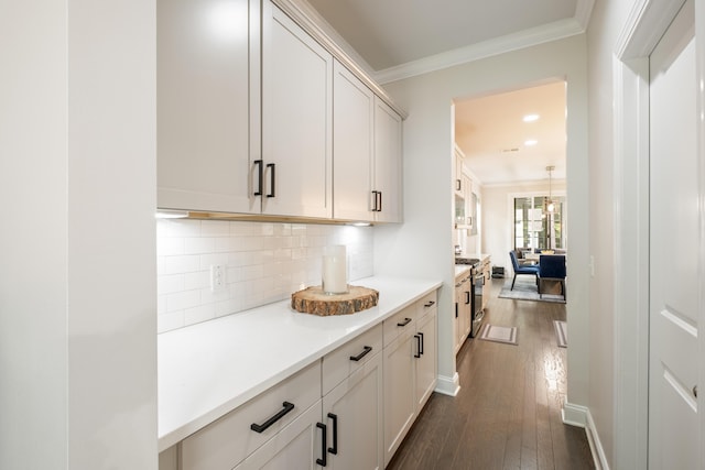 125 Beam St, Huger, SC 29450 - kitchen featuring ornamental molding, stainless steel gas range, dark wood-style floors, backsplash, and light countertops