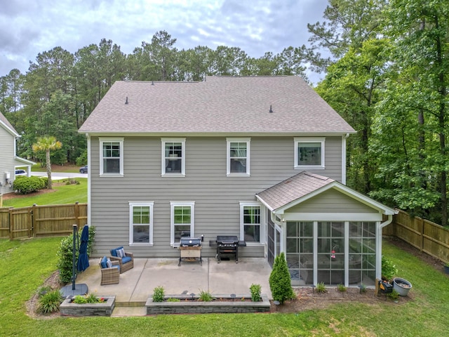 125 Beam St, Huger, SC 29450 - rear view of property featuring a patio area, a sunroom, and a shingled roof