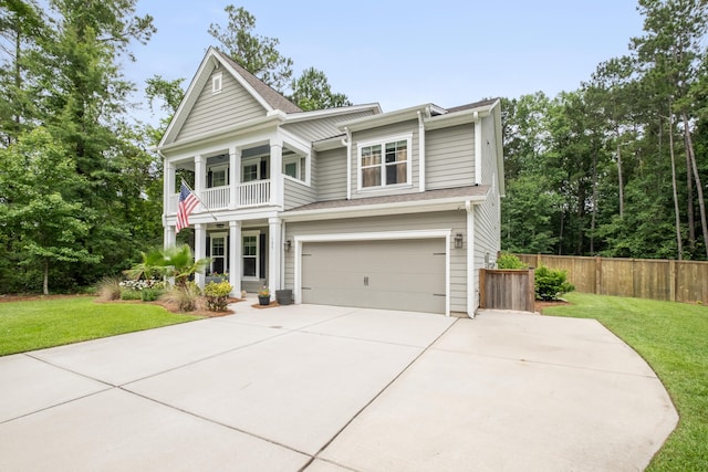 125 Beam St, Huger, SC 29450 - greek revival inspired property featuring a balcony, concrete driveway, covered porch, and an attached garage