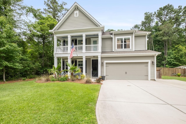 125 Beam St, Huger, SC 29450 - greek revival house featuring driveway, a balcony, an attached garage, and covered porch