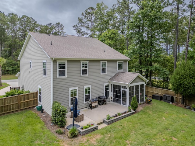 125 Beam St, Huger, SC 29450 - back of property with a sunroom, a patio, and a shingled roof
