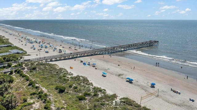 bird's eye view featuring a water view and a view of the beach