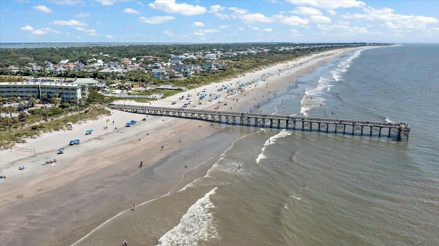 aerial view with a water view and a beach view