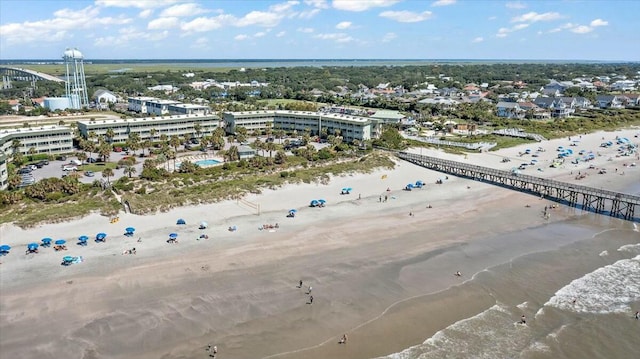 bird's eye view featuring a view of city, a water view, and a beach view