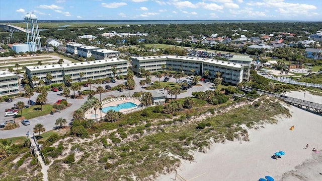 birds eye view of property with a water view and a city view