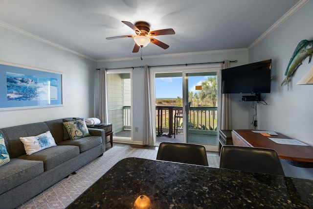 living area featuring ornamental molding, a ceiling fan, and wood finished floors