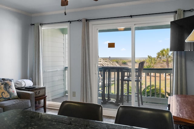 interior space featuring crown molding, wood finished floors, and ceiling fan
