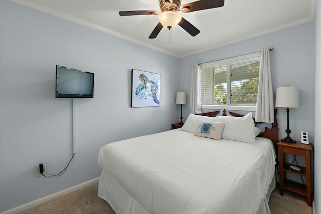 bedroom with light carpet, a ceiling fan, baseboards, and crown molding