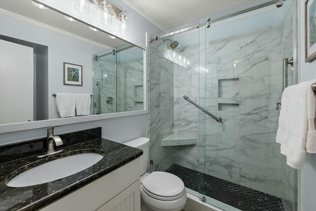 full bath with vanity, ornamental molding, a marble finish shower, and toilet