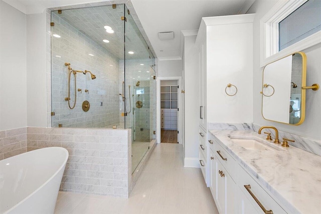 bathroom with plus walk in shower, tile patterned floors, and vanity