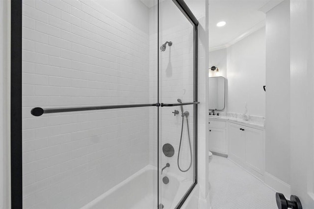 bathroom with crown molding, vanity, tile patterned flooring, and combined bath / shower with glass door