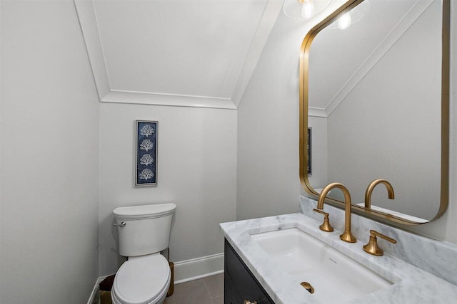 bathroom featuring ornamental molding, vanity, tile patterned floors, and toilet