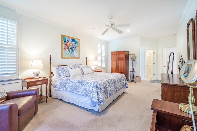 bedroom with a ceiling fan, crown molding, light colored carpet, and baseboards