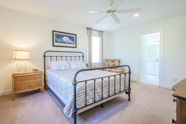 bedroom featuring baseboards, recessed lighting, ceiling fan, ensuite bathroom, and light carpet