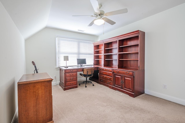 office with visible vents, baseboards, lofted ceiling, light carpet, and a ceiling fan