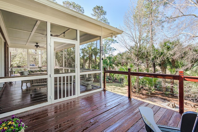 wooden deck featuring a sunroom