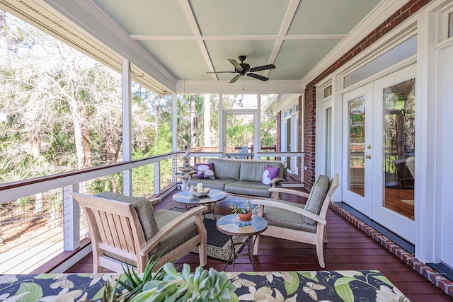 sunroom / solarium with french doors, coffered ceiling, and ceiling fan