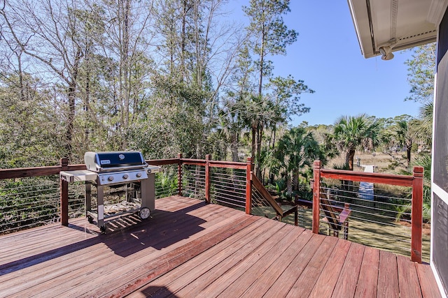 wooden terrace with area for grilling