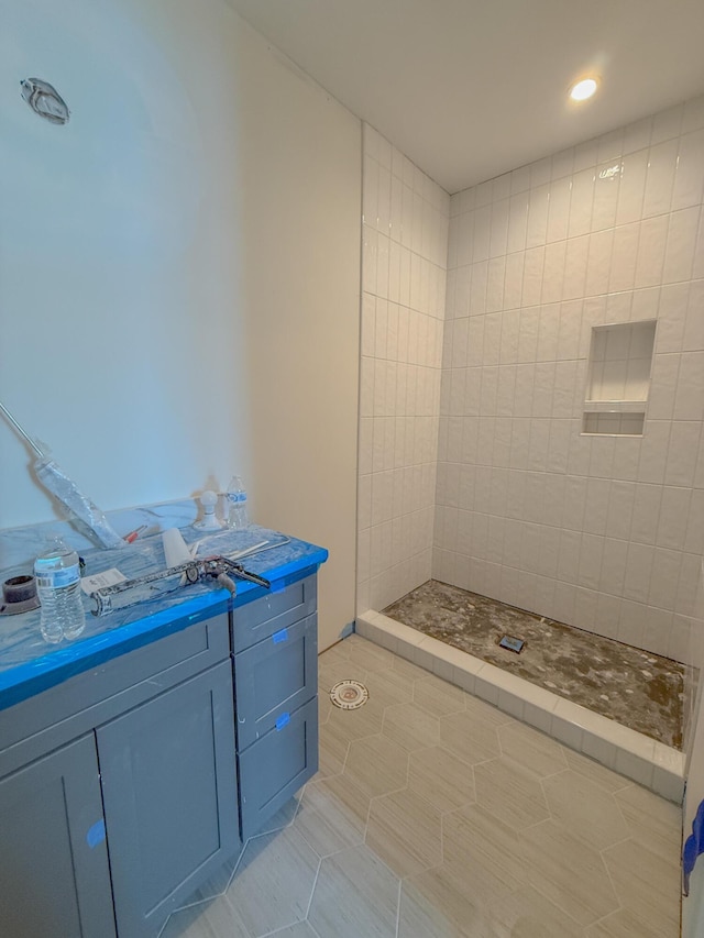 bathroom with a tile shower