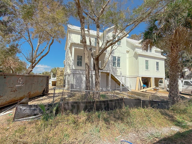 back of property with stairs