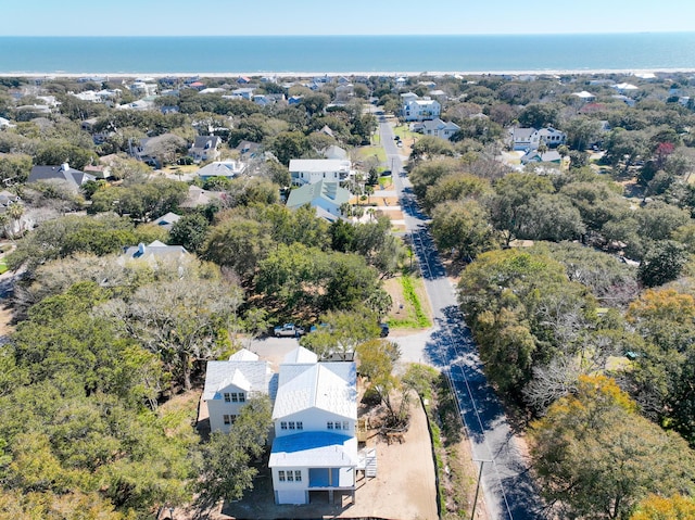 drone / aerial view with a residential view and a water view