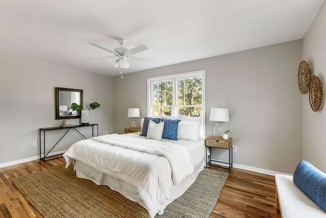 bedroom with hardwood / wood-style floors and ceiling fan