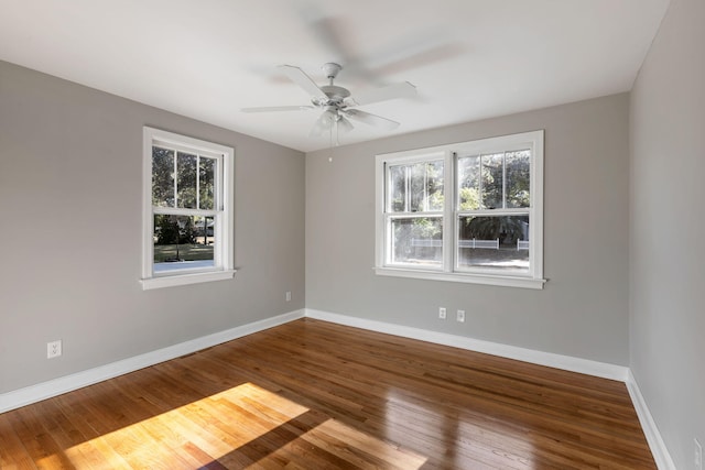 spare room featuring hardwood / wood-style flooring and ceiling fan