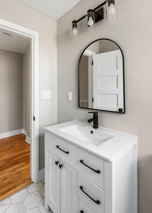 bathroom featuring hardwood / wood-style floors and vanity