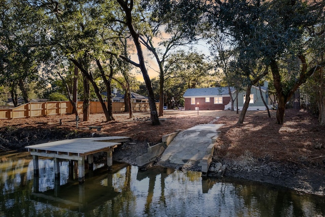 view of dock with a water view