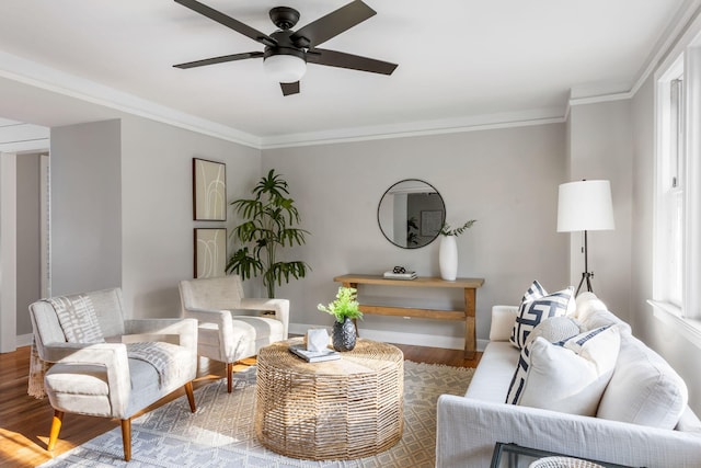 living room with crown molding, ceiling fan, and hardwood / wood-style flooring