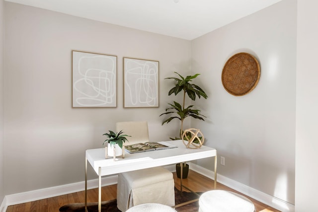 office space with wood-type flooring