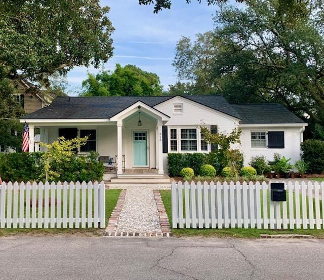 ranch-style house with a fenced front yard