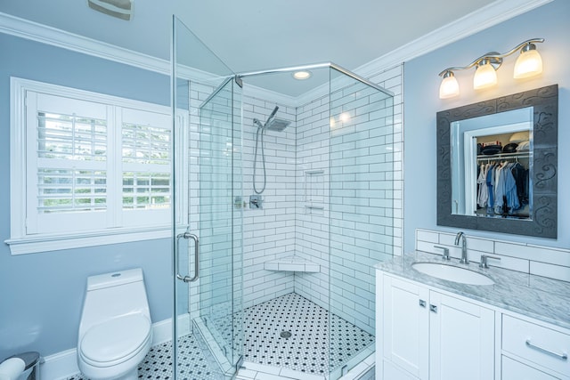 full bathroom featuring toilet, vanity, baseboards, ornamental molding, and a stall shower