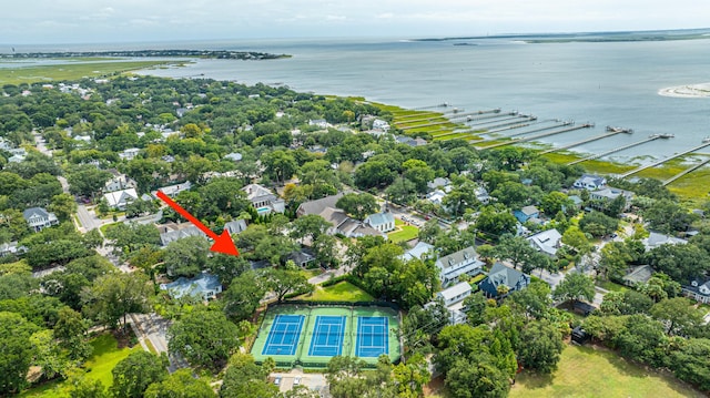 birds eye view of property with a water view