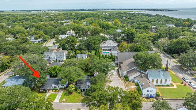 birds eye view of property with a water view and a residential view