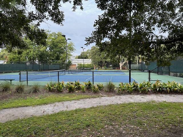 view of tennis court with fence