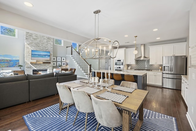 1166 Turkey Trot Dr, Johns Island, SC 29455 - dining room with recessed lighting, dark wood-style flooring, a chandelier, and a fireplace