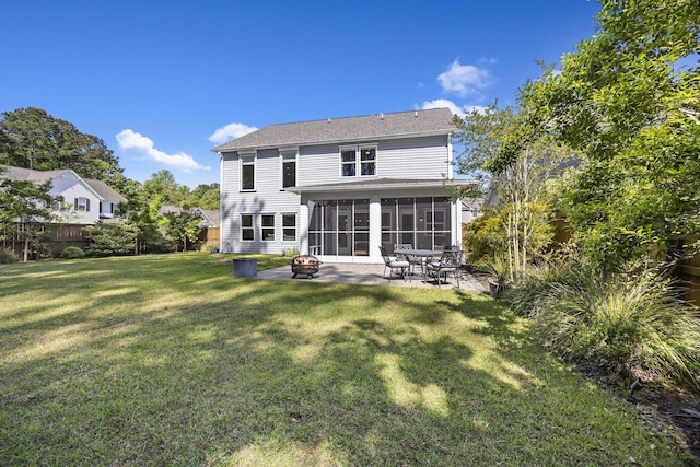 1166 Turkey Trot Dr, Johns Island, SC 29455 - back of property featuring a fire pit, fence, a lawn, a sunroom, and a patio