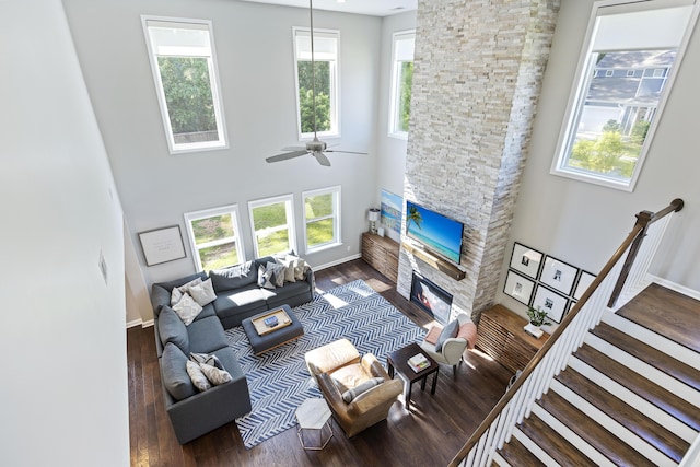 1166 Turkey Trot Dr, Johns Island, SC 29455 - living room with a fireplace, wood finished floors, a towering ceiling, and plenty of natural light