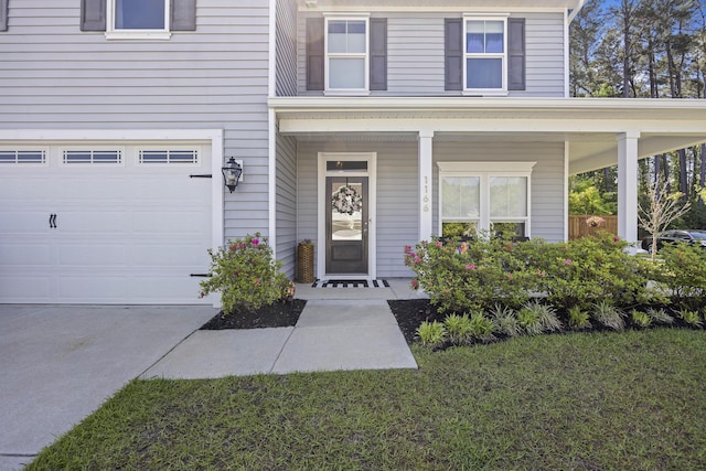1166 Turkey Trot Dr, Johns Island, SC 29455 - doorway to property with an attached garage, a lawn, covered porch, and driveway