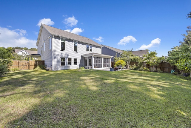 1166 Turkey Trot Dr, Johns Island, SC 29455 - back of house featuring a fenced backyard, a gate, a sunroom, and a yard