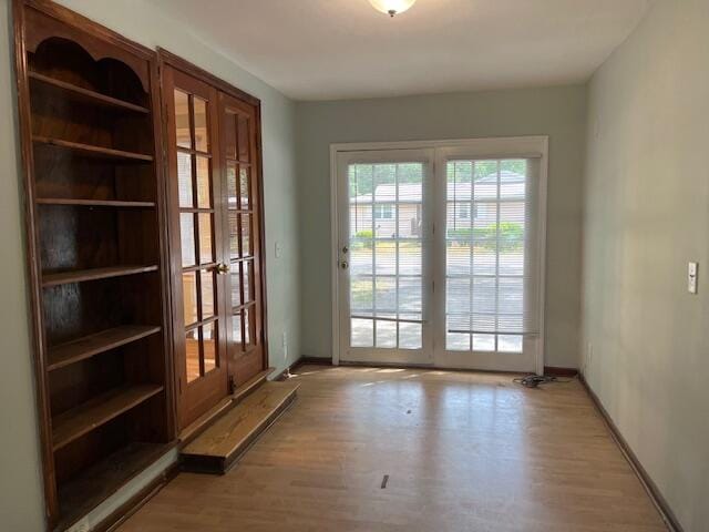 doorway featuring french doors and light hardwood / wood-style floors