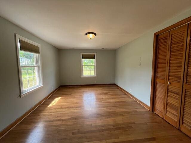 unfurnished room with light hardwood / wood-style flooring