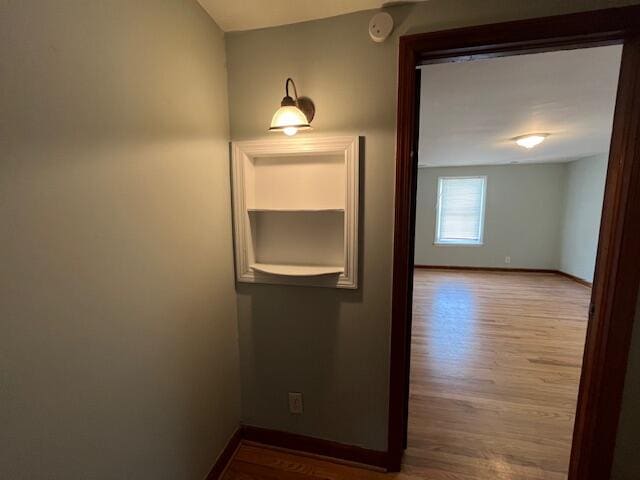 hall with light hardwood / wood-style floors