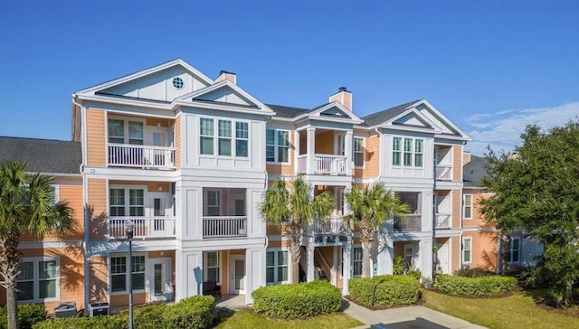 view of front of property with a balcony